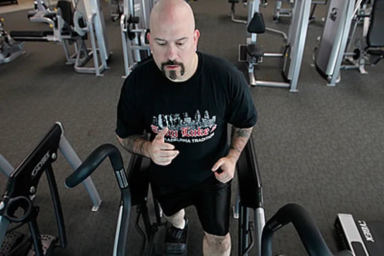Tony Luke of Tony Luke's Steaks in South Philadelphia works out in the health club at his Waterfront Square condo. Exercise has helped him shed about 100 pounds. (Alejandro A. Alvarez / Staff Photographer)