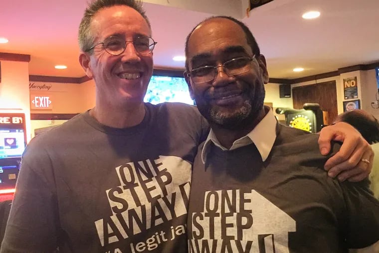 Kevin Roberts (left) during an event to benefit One Step Away, Philadelphia's homeless newspaper.