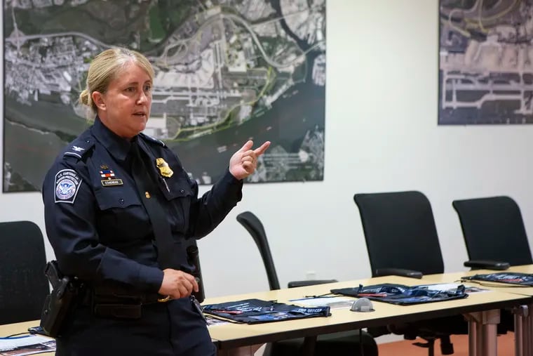 Kayla Etheridge, a recruiter at U.S. Customs and Border Protection, gives a PowerPoint presentation at a CBP job fair at the Philadelphia International Airport. The agency is seeking to hire for jobs in the Philadelphia area.