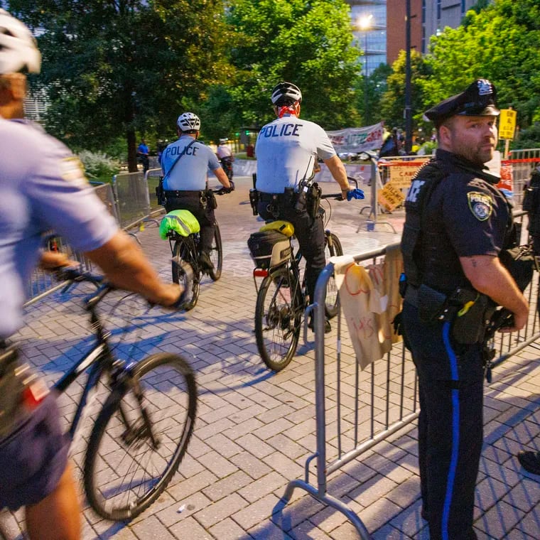 Philadelphia Police bicycle officers and Drexel University police at perimeter of pro-Palestinian encampment as protestors left Drexel early Thursday.
