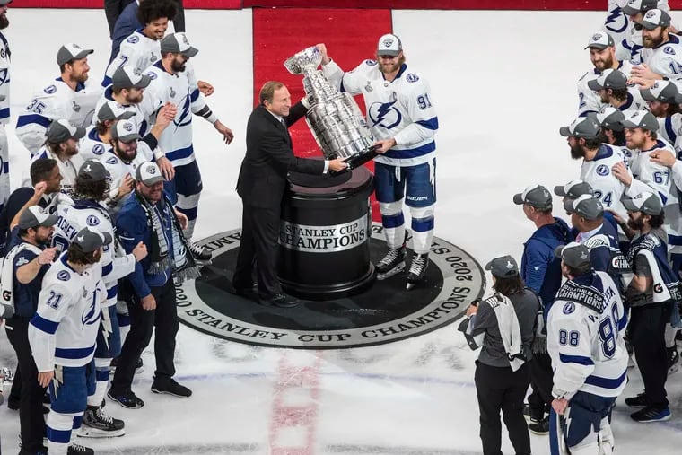 The Tampa Bay Lightning's Steven Stamkos is presented with the Stanley Cup from NHL commissioner Gary Bettman after the 2019-20 season. The upcoming season could be even more challenging than this year's.