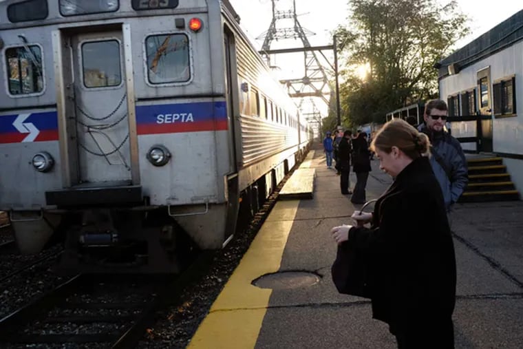 East Falls commuters wait for a Regional Rail train. At the rate of growth in Philadelphia, train service could be overwhelmed with riders in a matter of years, SEPTA officials said.