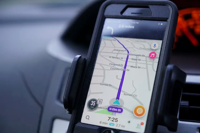 Former police data analyst Davin Hall uses the Waze navigation app while driving through Greensboro, N.C.