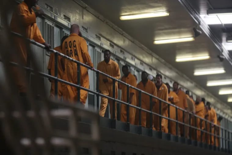 Inmates return to their cells at Graterford Prison.