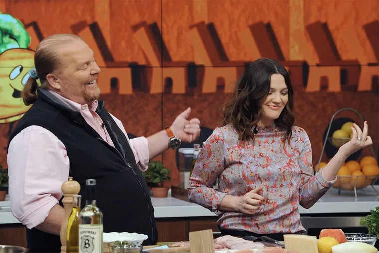 Celebrity chef Mario Batali makes a meal with Drew Barrymore on ABC’s “The Chew.” Bataldi has stepped down from the show and his restaurants after allegations of sexual misconduct have surfaced.