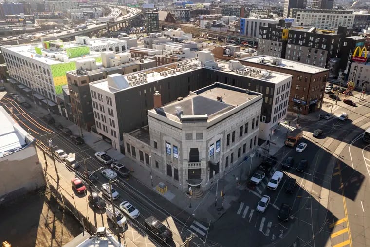 The former Kensington National Bank building at Frankford and Girard Avenues is being turned into a large retail space and apartments by the same developer that built the Avant, the new apartment building that wraps around it.