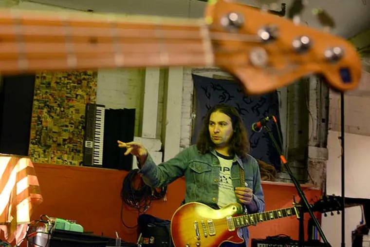 Singer-songwriter Adam Granduciel rehearses with his band, The War on Drugs, at their practice space in Kensington. (Tom Gralish / Staff Photographer)