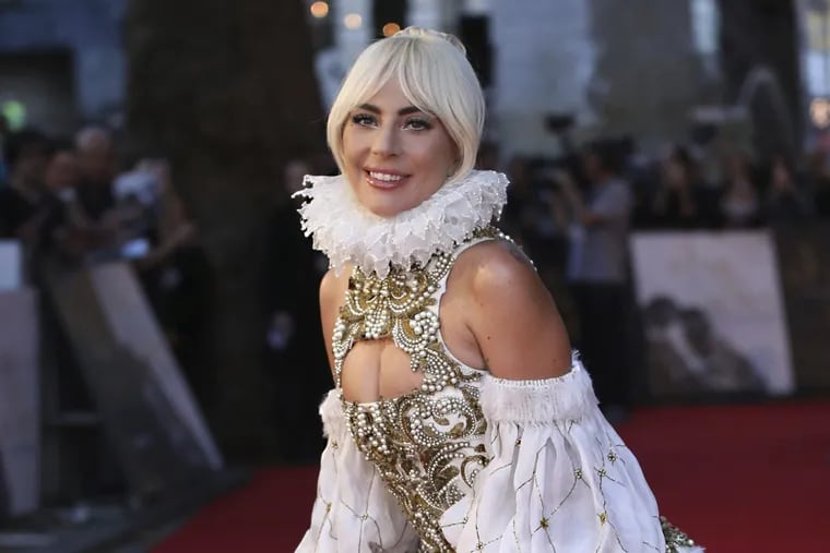 FILE – In this Sept. 27, 2018, file photo, actress and singer Lady Gaga poses for photographers upon arrival at the premiere of the film "A Star Is Born" in London.