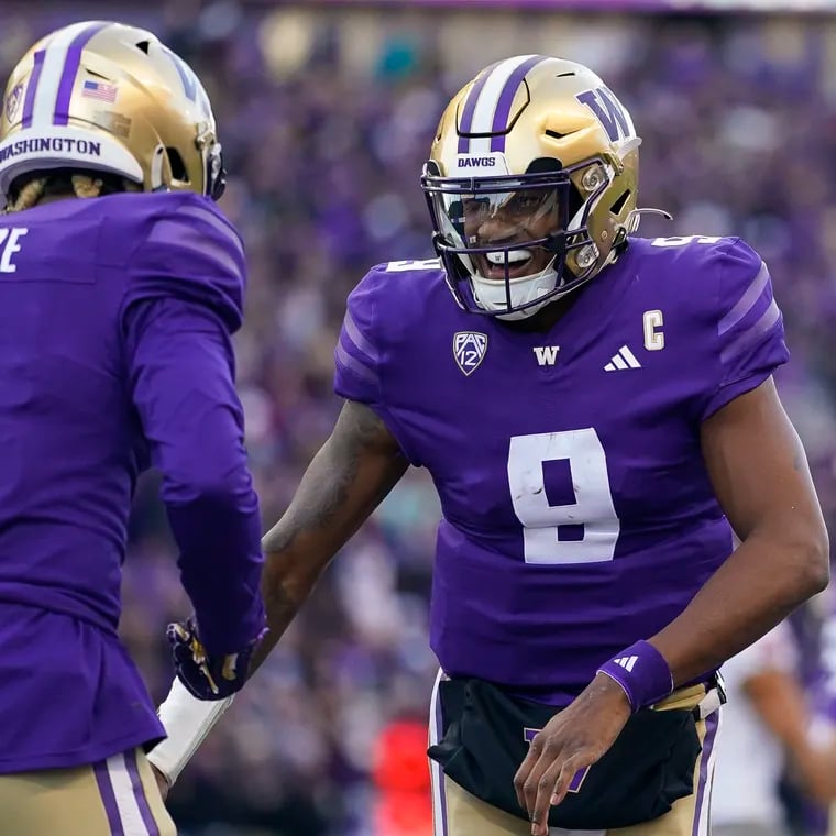 Washington quarterback Michael Penix Jr. (9) celebrates throwing a touchdown to wide receiver Rome Odunze (1) against Washington State during the first half of an NCAA college football game, Saturday, Nov. 25, 2023, in Seattle. (AP Photo/Lindsey Wasson)