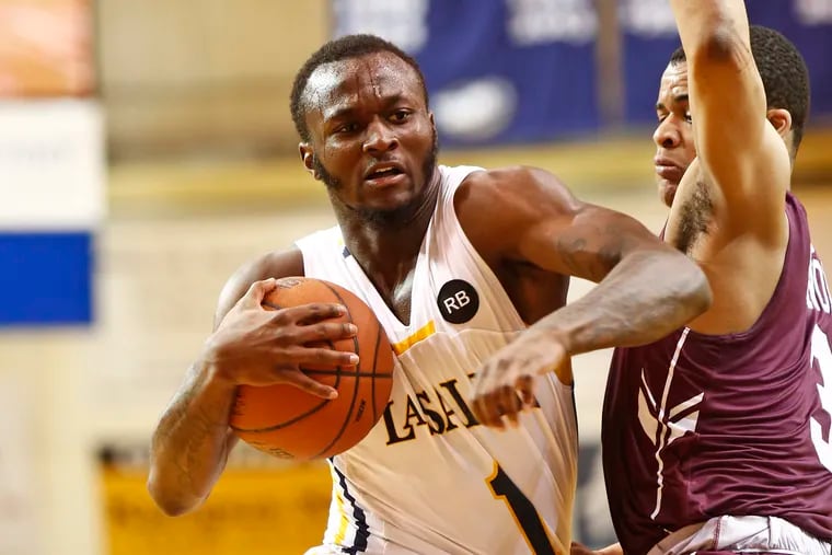 La Salle guard David Beatty drives to the basket against Fordham guard Nick Honor during the second half of an Atlantic 10 basketball game Saturday, March 9, 2019, at Tom Gola Arena. The Explorers went on to win, 72-57. LOU RABITO / Staff