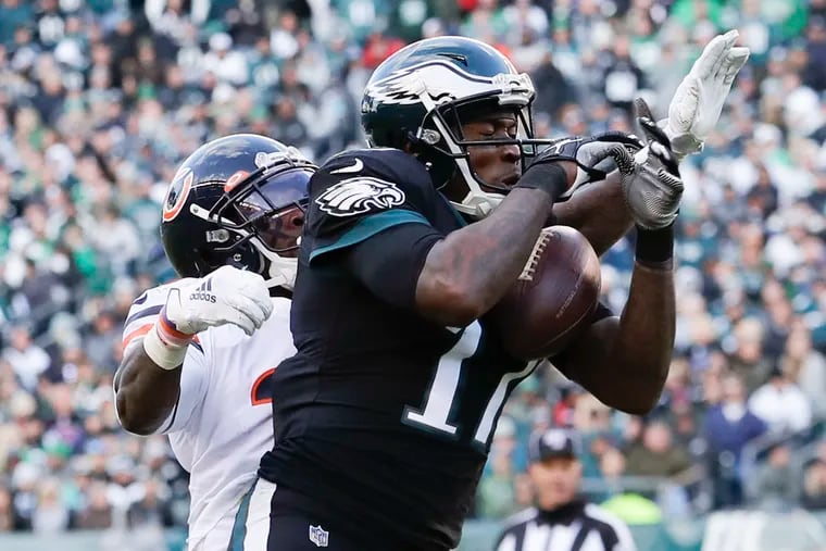 Eagles wide receiver Alshon Jeffery catches the football for a first down in the fourth quarter past Chicago Bears free safety Eddie Jackson on Sunday, November 3, 2019 in Philadelphia.