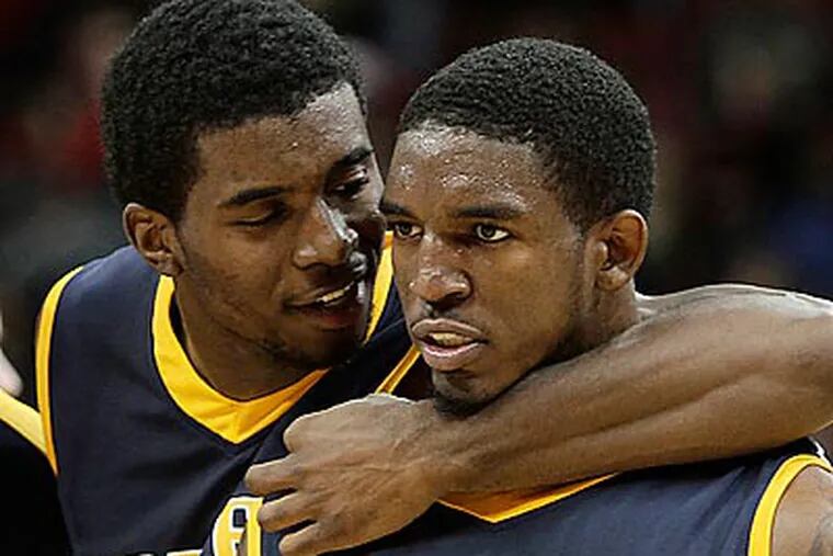Gerald Colds (right) scored 20 points to lead Drexel to an upset of powerhouse Louisville. (Garry Jones/AP)