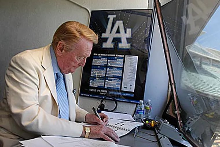 Dodgers broadcaster Vin Scully will return to the booth for his 64th season next year. (Jae C. Hong/AP)