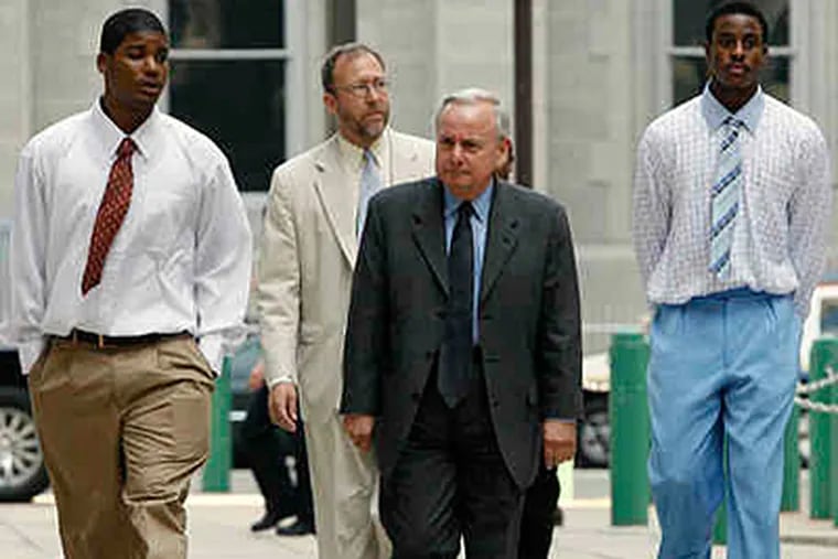 Nashir Fisher (left), with attorney Lee Mandel; behind them, Ameer Best, with attorney Stephen Brown. Fisher and Best were convicted of 3d-degree murder in the subway-beating death of Sean Conroy. (Alejandro A. Alvarez / Staff / File)