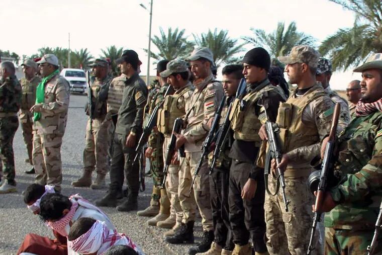 Shiite militiamen detaining suspected extremists last month in Beiji, about 155 miles north of Baghdad.
