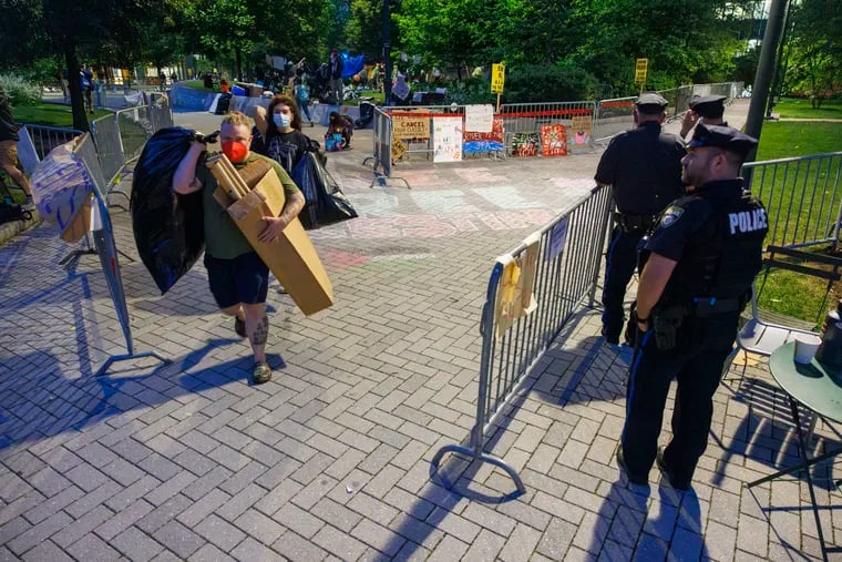 Philadelphia and Drexel University police at perimeter of pro-Palestinian encampment as protestors left Drexel early Thursday.