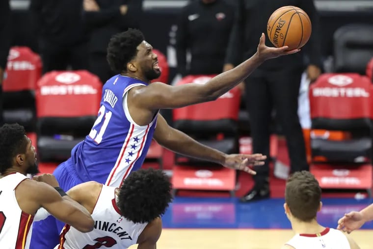 Joel Embiid scores over Gabe Vincent of the Heat. The Sixers are still at No. 7 in the power rankings.