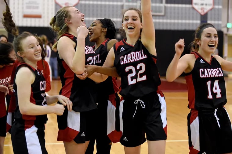 Archbishop Carroll's starters celebrate as they win in overtime, defeating Southern Lehigh 39-32 in the PIAA Class 5A Girls semifinal at Souderton High School March 19, 2019.
