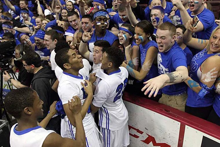Conwell-Egan's players and fans celebrate the 62-51 win in the PIAA Class AA Final against Aliquippa at Giant Center in Hershey, Pa. Saturday March 21, 2015. (David Swanson/Staff Photographer)