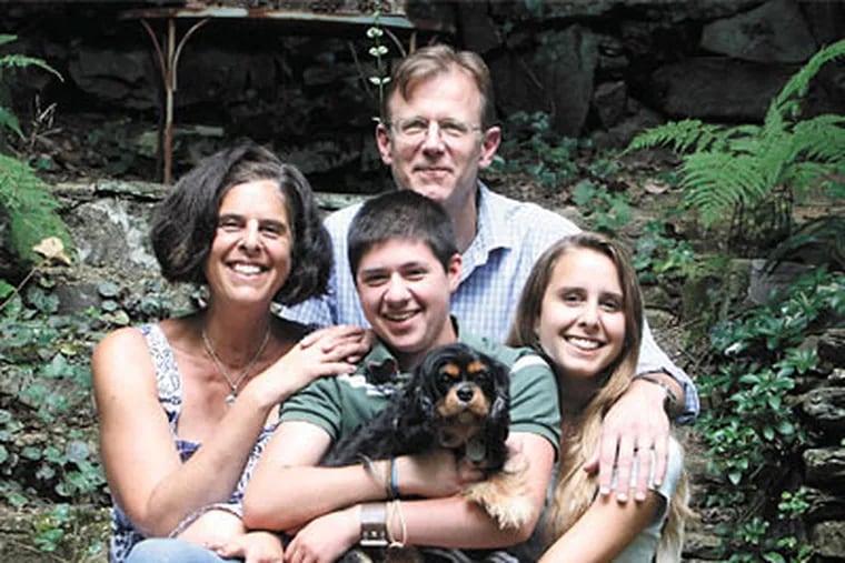 Ty Clark (center) with his family, top, in their Wyncote yard: mother Rory Cohen, father Matthew Clark, sister Shane Clark, 17, and dog Cocoa. (Bonnie Weller/Staff Photographer)