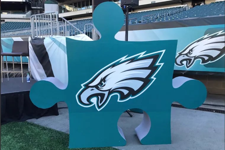 At Lincoln Financial Field, an Eagles-themed puzzle piece, the primary symbol for autism, was displayed as Jeffrey Lurie announced a partnership to raise funds for autism research.