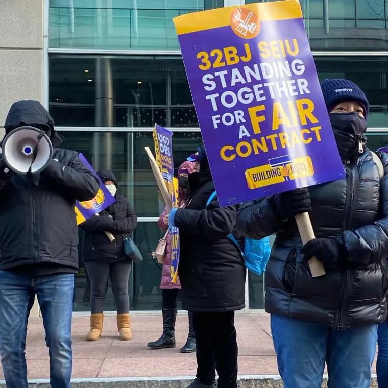 Commercial office cleaners who are members of Service Employees International Union (SEIU) Local 32BJ march in Conshohocken on Tuesday, Nov. 28, demanding a better contract.