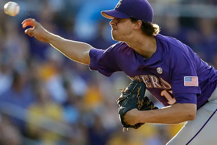 Aaron Nola throws in the first inning of an NCAA college baseball regional tournament game against Houston in Baton Rouge, La., Saturday, May 31, 2014. (Gerald Herbert/AP)