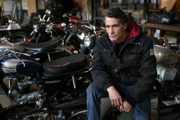Adam Cramer at his motorcycle shop, Liberty Vintage, in Fishtown on Thursday. Cramer plans to rent out half of his shop.