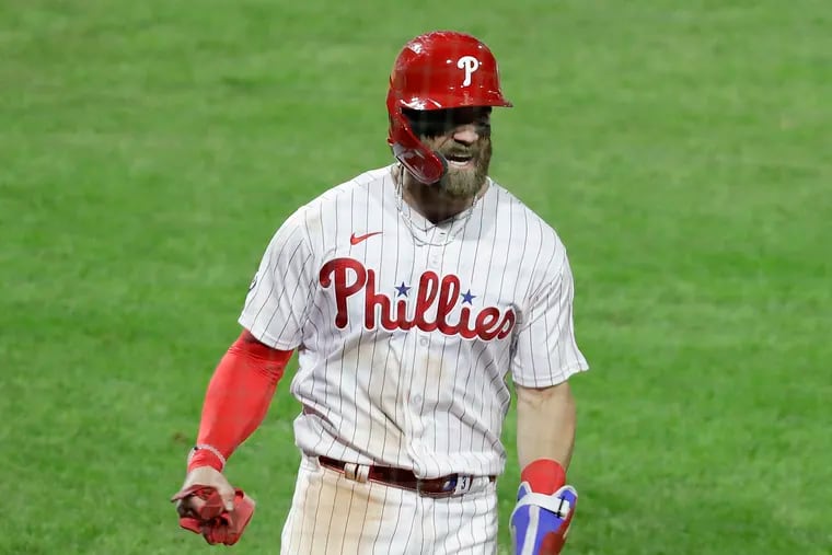 Phillies Bryce Harper yelling after scoring in the eighth inning against New York Mets on April 5.