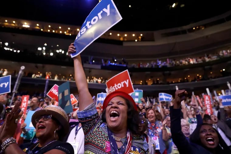 Delegates cheer as Democratic Presidential candidate Hillary Clinton appears on the screen during the second day session of the Democratic National Convention in Philadelphia, Tuesday, July 26, 2016.