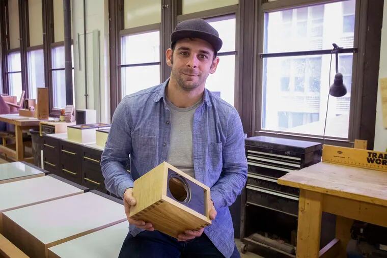 Keith Lockerby at his woodworking shop, J&K Lockerby Engineering & Fabrication. He and his crew make furniture and cabinetry, like this oak speaker housing.