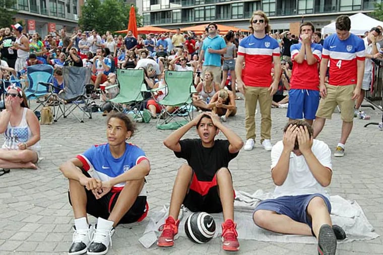 Disappointed United States soccer fans react after Belgium scored their first goal during extra time in the knock out stage of World Cup Soccer at The Piazza at Schmidts in Northern Liberties on Tuesday, July 1, 2014.