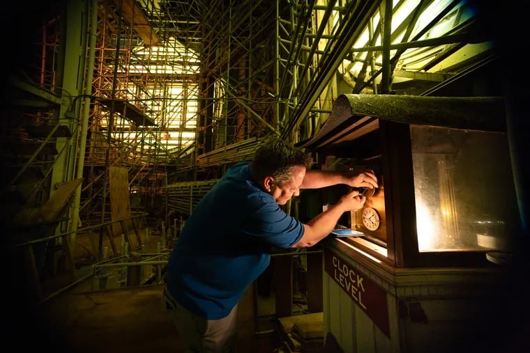 Joe Brasky, a Building Service Manager at Philadelphia City Hall, adjusts one of the the clocks to daylight savings time in the tower of City Hall, in Philadelphia, early on Sunday morning, March 10, 2019.