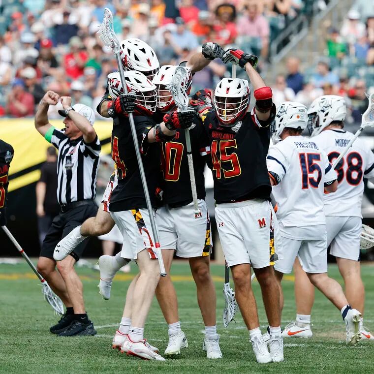 Maryland defender Colin Burlace (center) celebrates his second-quarter goal with his teammates against Virginia in the second semifinal of the NCAA men's lacrosse championships at Lincoln Financial Field on Saturday.