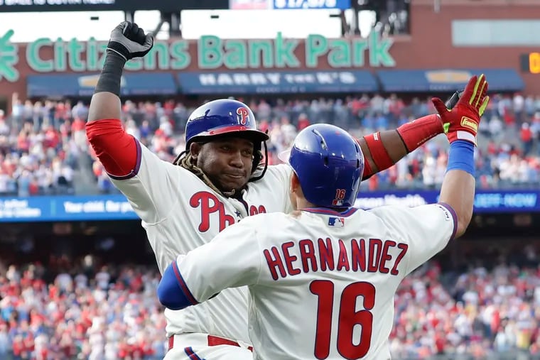 Phillies third baseman Maikel Franco celebrates his two-run home run with teammate Cesar Hernandez against the Atlanta Braves on  March 30.