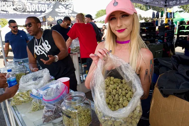 In this April 21, 2018, file photo, a budtender offers attendees the latest products of cannabis at the High Times 420 SoCal Cannabis Cup in San Bernardino, Calif.  A bill introduced in New Jersey would decriminalize  the possession of up to a pound of marijuana.