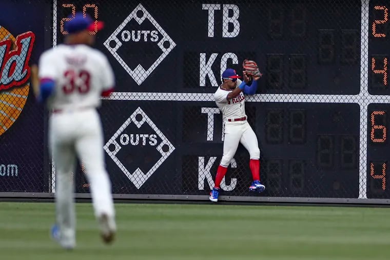 Philadelphia Phillies center fielder Johan Rojas makes the catch off the wall in the first inning of his major league debut in a game against the San Diego Padres at Citizens Bank Park on July 15.