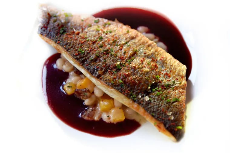 The branzino with beurre rouge comes over white beans with bacon and squash at Townsend near  Rittenhouse Sqare.
