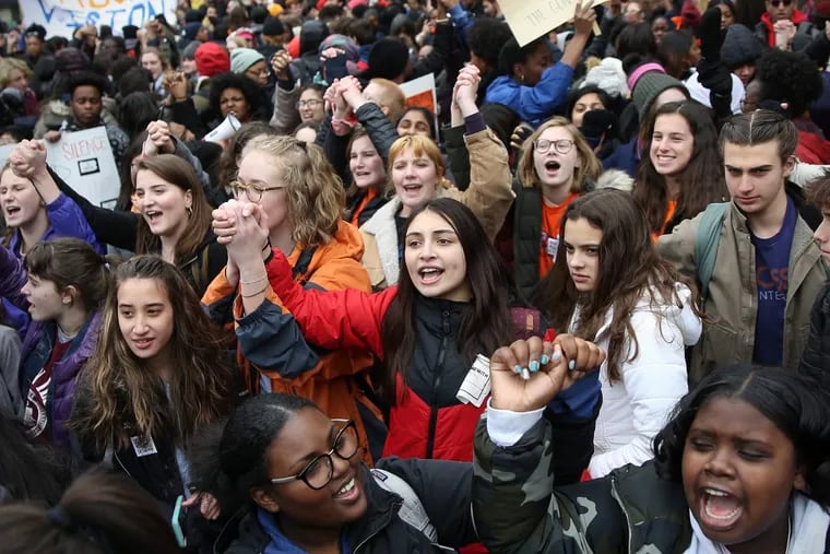 Protests against gun violence also occurred earlier in March when students across the nation, including in Philadelphia (above), walked out in remembrance of the 17 people killed in the Parkland, Fla., high school shooting.