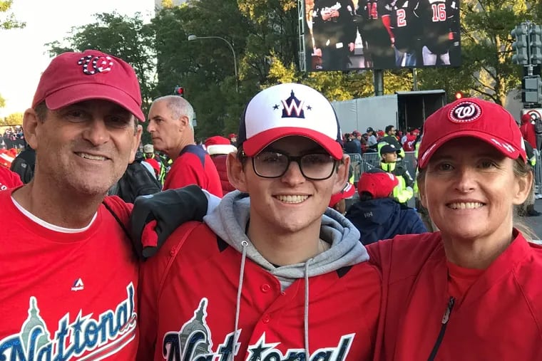 Michele Crowl, right, with husband Cavin, left, and son Ryan during the Nationals' 2019 World Series parade.