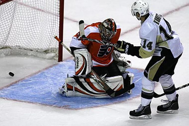 Chris Kunitz scores on Flyers goalie Sergei Bobrovsky in the first period. (H. Rumph, Jr./AP)