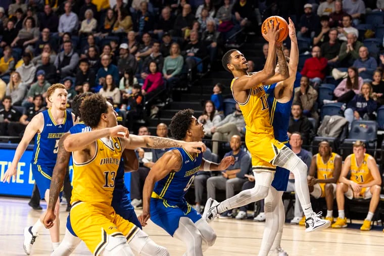 Drexel guard Justin Moore (11) led the Dragons with 21 points in an overtime win against Delaware at the Daskalaskis Athletic Center on Saturday.