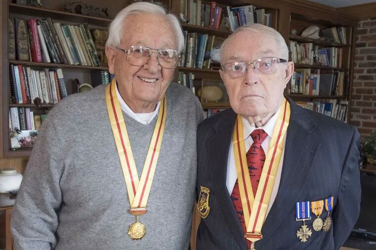 Jack Goodrich (left) and Clifford Long wear their Chinese medals.