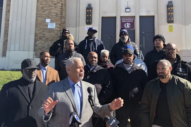 State Sen. Anthony Hardy Williams meets on March 25 with anti-crime activists to announce a "Citywide Peace Pledge" in front of John Bartram High School in Southwest Philadelphia.