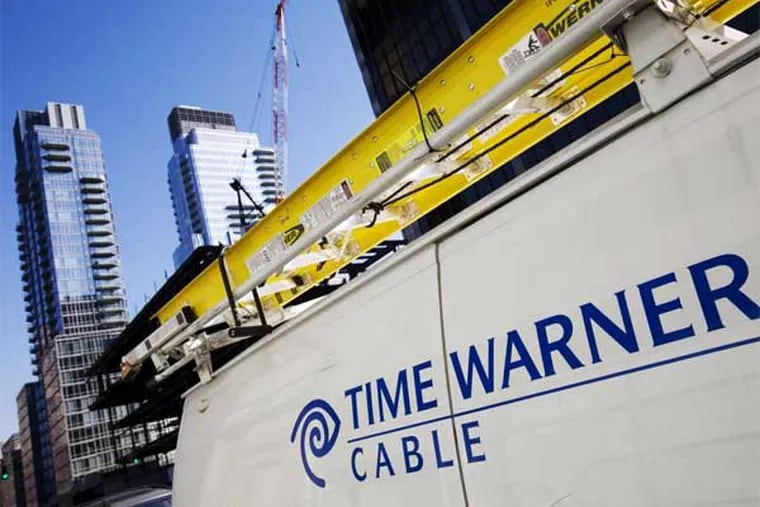 FILE - In this Feb. 2, 2009 file photo, a Time Warner Cable truck is parked in New York. (AP Photo/Mark Lennihan, file)