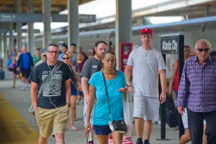 Passengers disembark from the New Jersey Transit Atlantic City Rail Line at Atlantic City Station on August 9, 2018. The line which runs between Philadelphia and Atlantic City is slated for a 5 month suspension. Avi Steinhardt / For the Inquirer