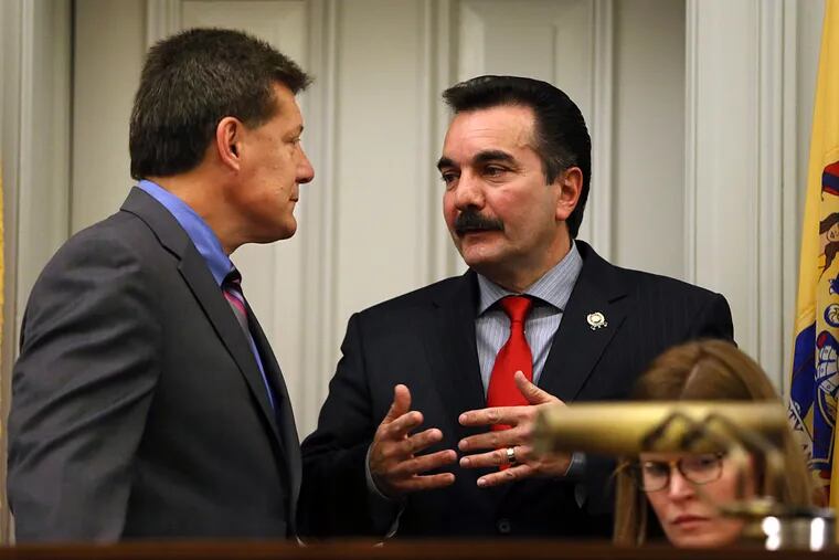 New Jersey Assembly Speaker Vincent Prieto, right, D-Secaucus, N.J., talks with Assembly Judiciary Committee chairman, Assemblyman John F. McKeon, D-Madison, N.J., before a meeting over the ongoing showdown over the future of Atlantic City.