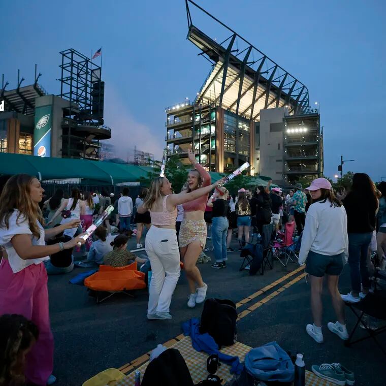 Taylor Swift fans danced in the street after police closed South 11th Street between Lincoln Financial Field and the Wells Fargo Center on May 13, 2023.