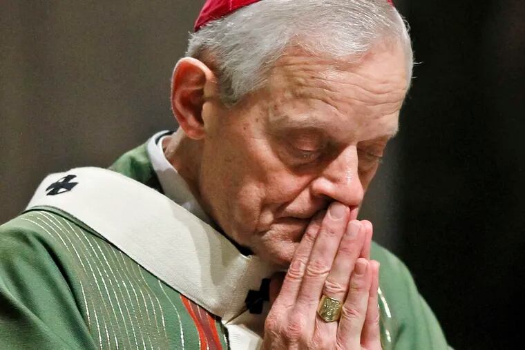 In this Wednesday, Oct. 20, 2010 file photo, Archbishop Donald Wuerl prays as he celebrates Mass at the Cathedral of Saint Matthew the Apostle in Washington.