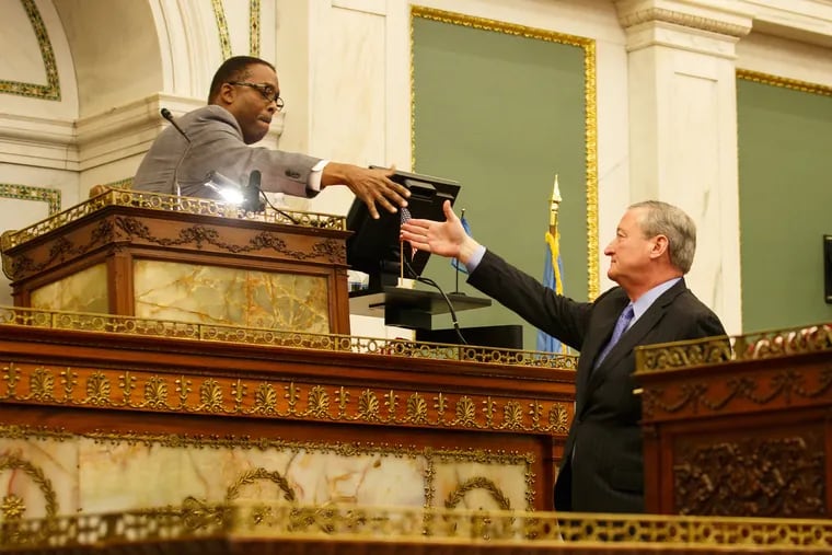 City Council President Darrell L. Clarke and Mayor Kenney shake hands in a 2017 file photo. Kenney and city council reached an agreement Thursday to fund affordable housing without the controversial 1 percent tax on new construction in the city.